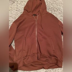 Zip up jacket with hood.